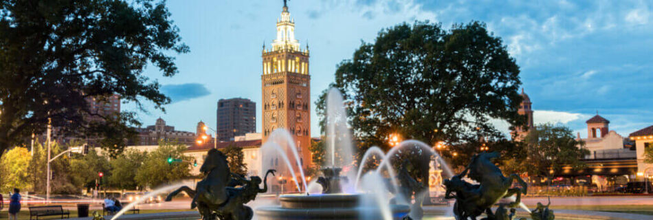 Kansas City suites downtown skyline with fountain foreground, near Independence MO