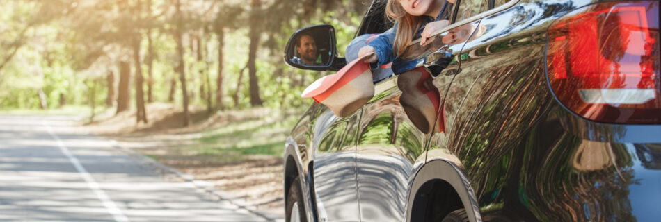 family in car on vacation