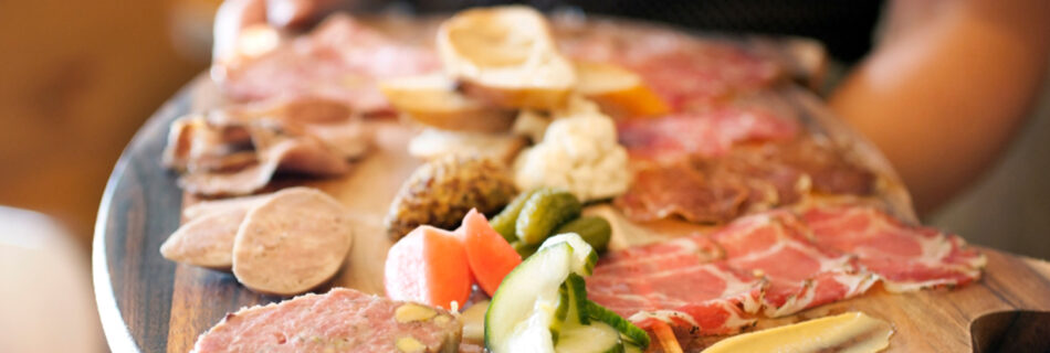 chef holding charcuterie board