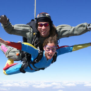 man and woman skydiving