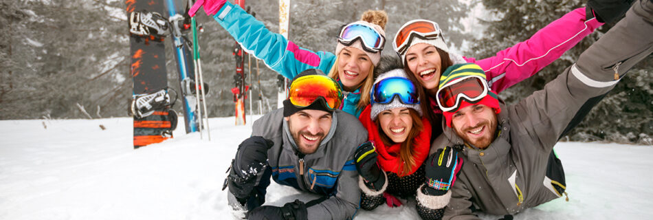 group of young people on ski hill
