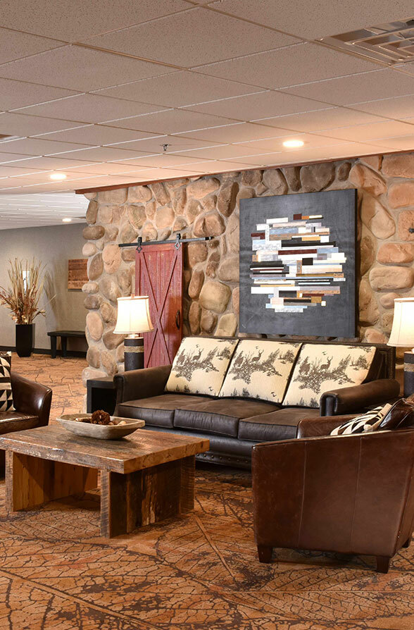 Family with children relaxing in hotel common area, St. Joseph MO